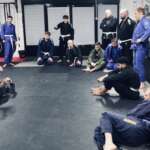 Our members listening to Sid teaching a BJJ technique